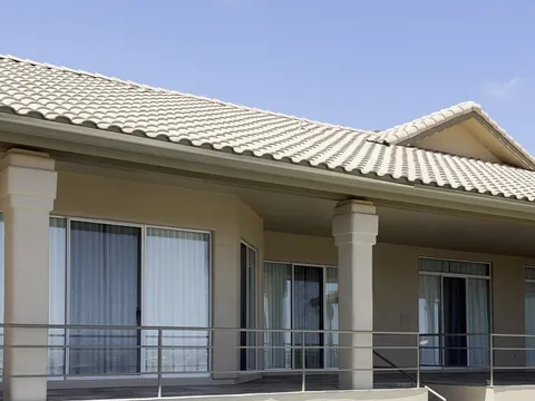 Hillside Fountain Hills AZ stucco home with pool after full exterior repaint in warm cream