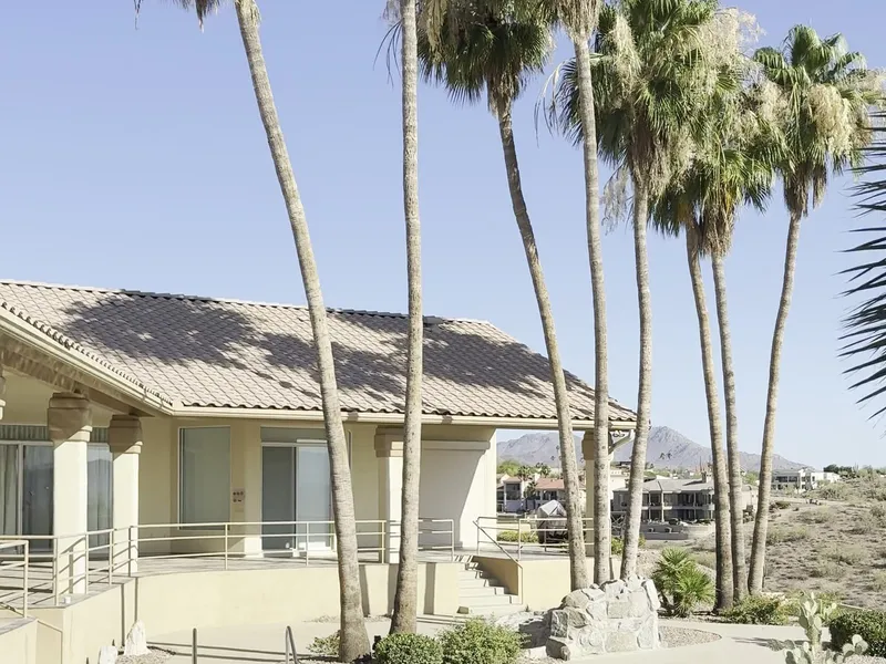 Hillside Fountain Hills AZ stucco home with pool after full exterior repaint in warm cream