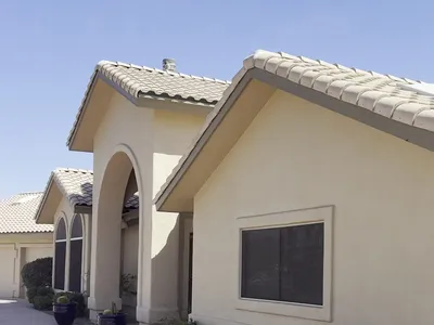Front elevation of Fountain Hills AZ home with tile roof and arched windows after exterior painting