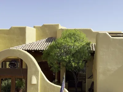 Crew prepping and finished entry courtyard of Santa Fe style custom home in Fountain Hills AZ